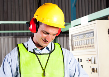 Employee undergoing a workplace hearing test to assess hearing health and identify potential hearing loss