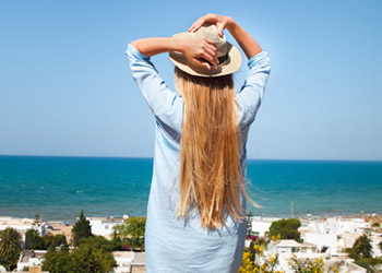 Women wearing protective clothing to shield skin from UV radiation