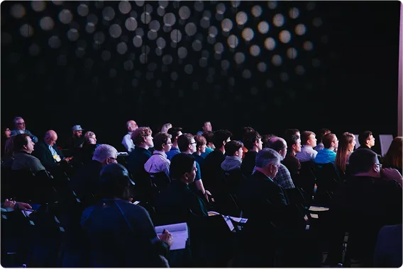 Conference participants engaged in learning