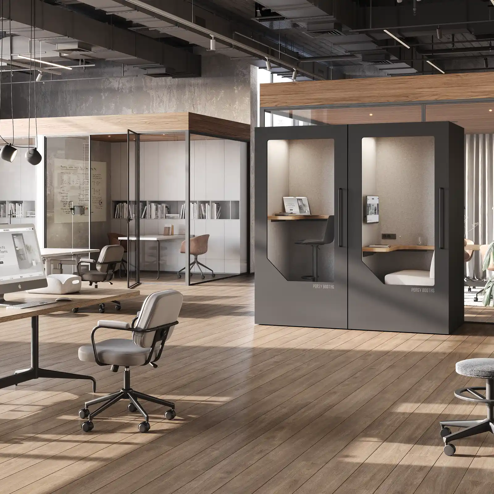 Two Persy Booths office pods integrated into a modern open plan office with desks and chairs