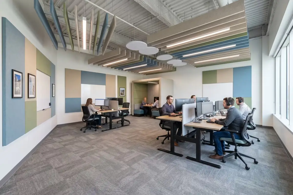 Open plan office with acoustic panels and ceiling baffles for noise control