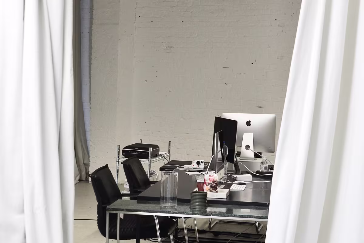 Noise canceling curtains separating a quiet workspace in an open office