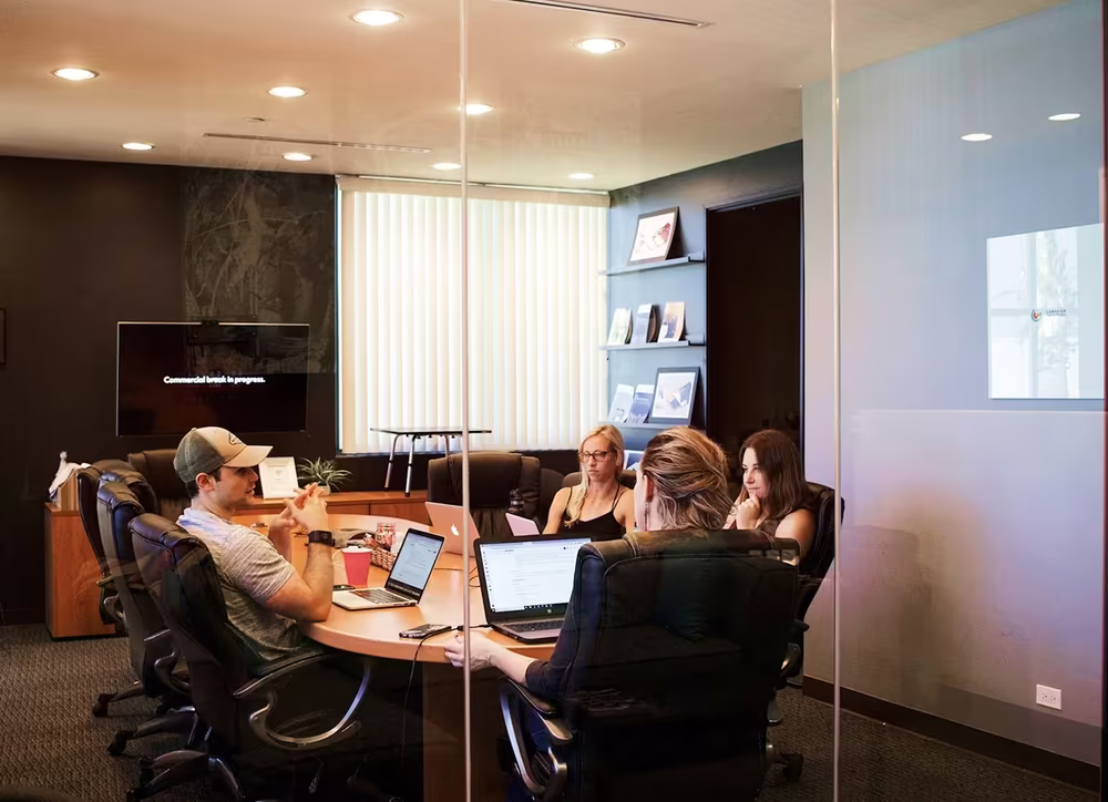 Team collaboration in a small huddle room supporting quick discussions and idea sharing