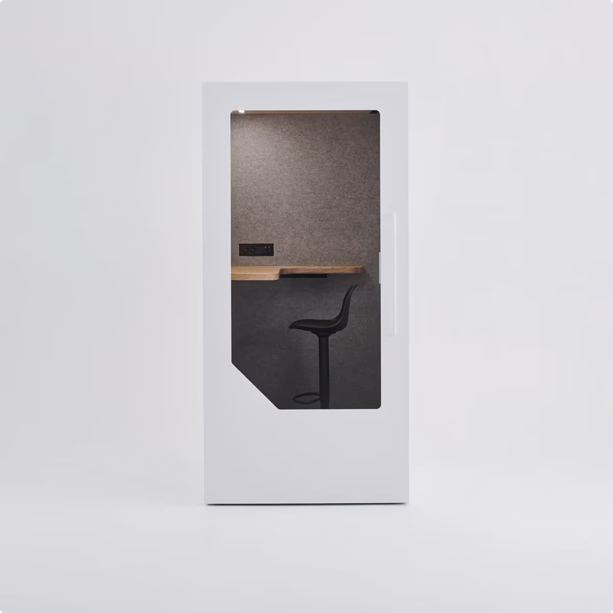 Interior of an office pod showing desk, lighting, and power outlets