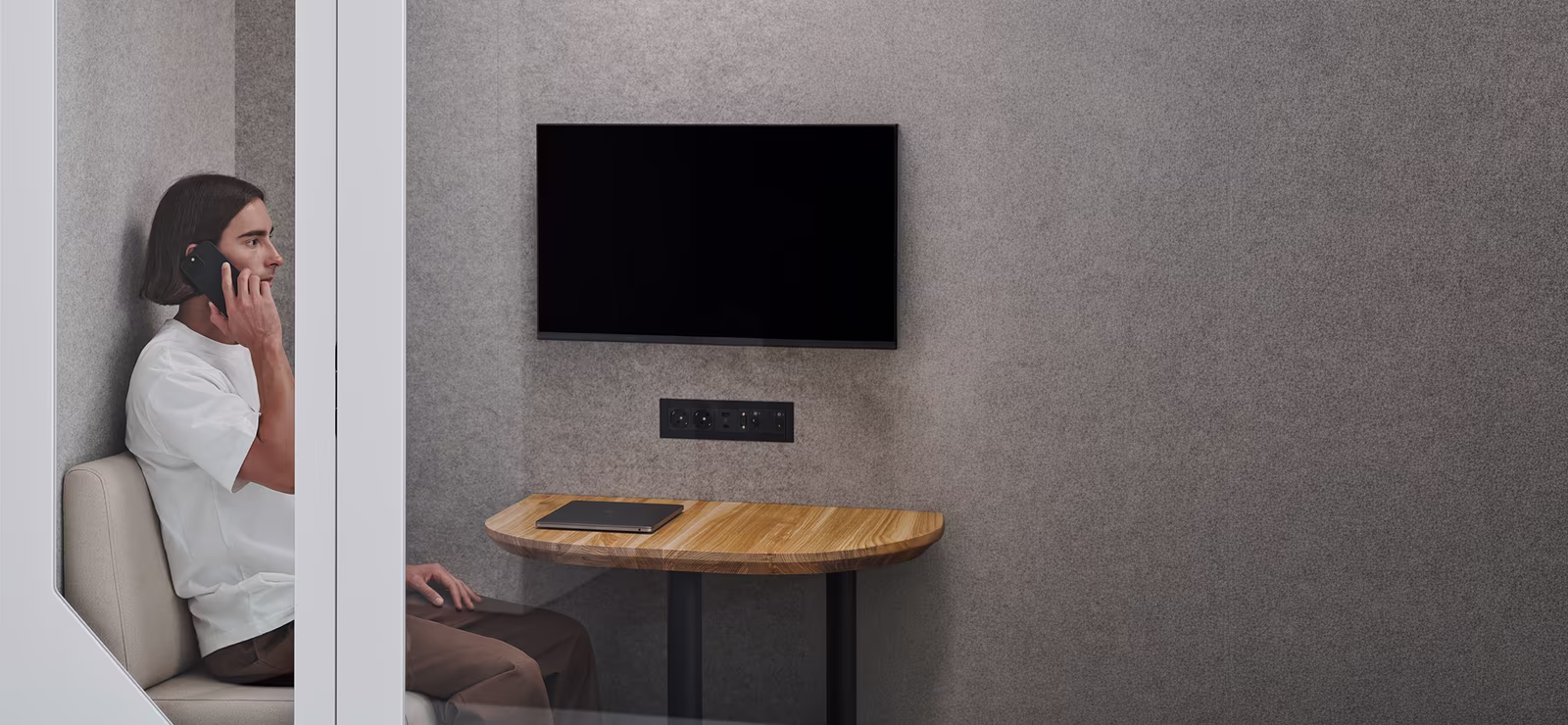 Minimal meeting space with table and screen in office environment