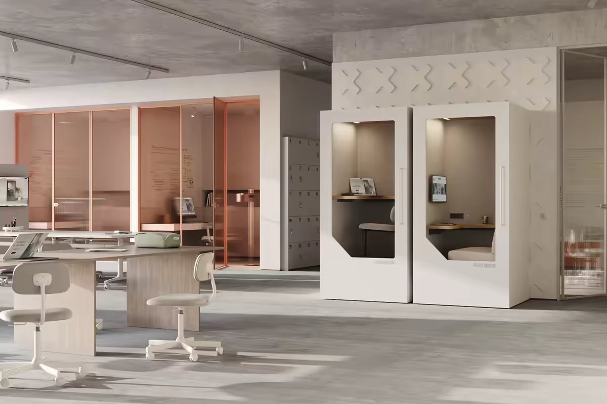 Open plan office layout with Persy Booths pods integrated alongside desks and chairs