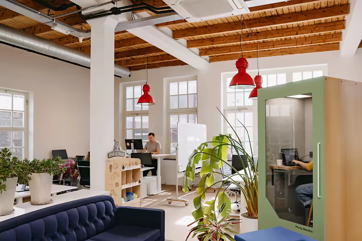 Persy Booths office pod integrated into a bright open plan office workspace
