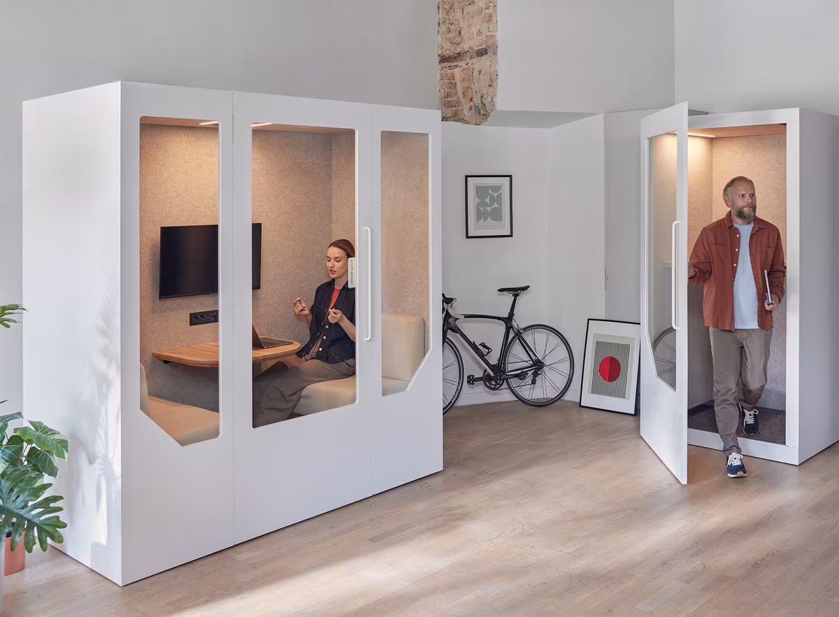 Students using a comfortable private study booth on a university campus