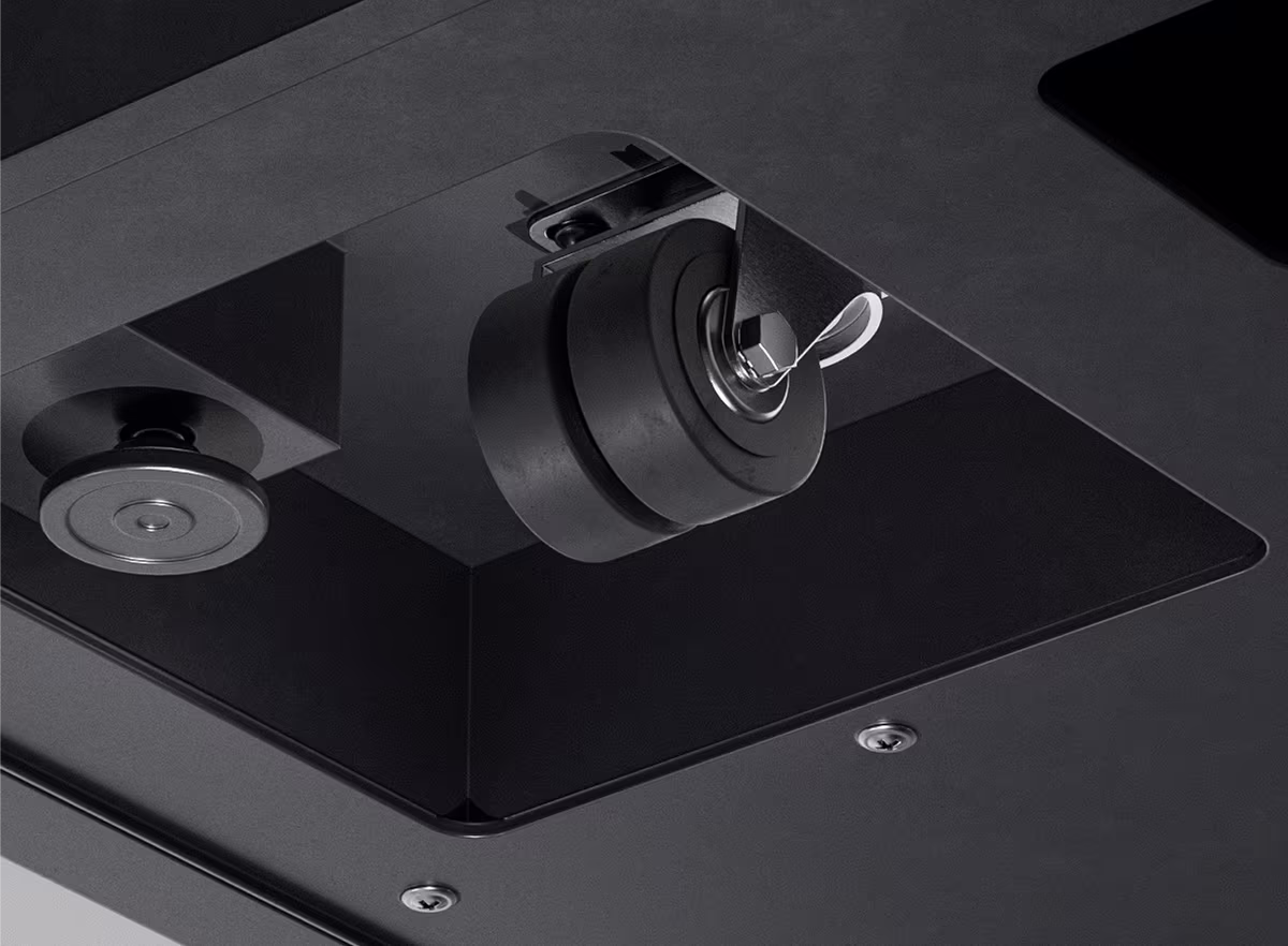 Close-up of mobile caster wheels on a movable university study booth