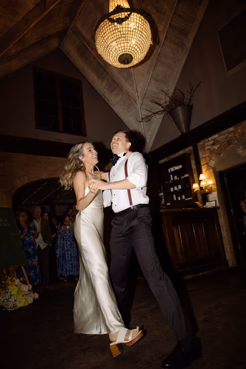Lucy and Jonathan having their first dance at Mudbrick Restaurant and Vineyard on Waiheke Island