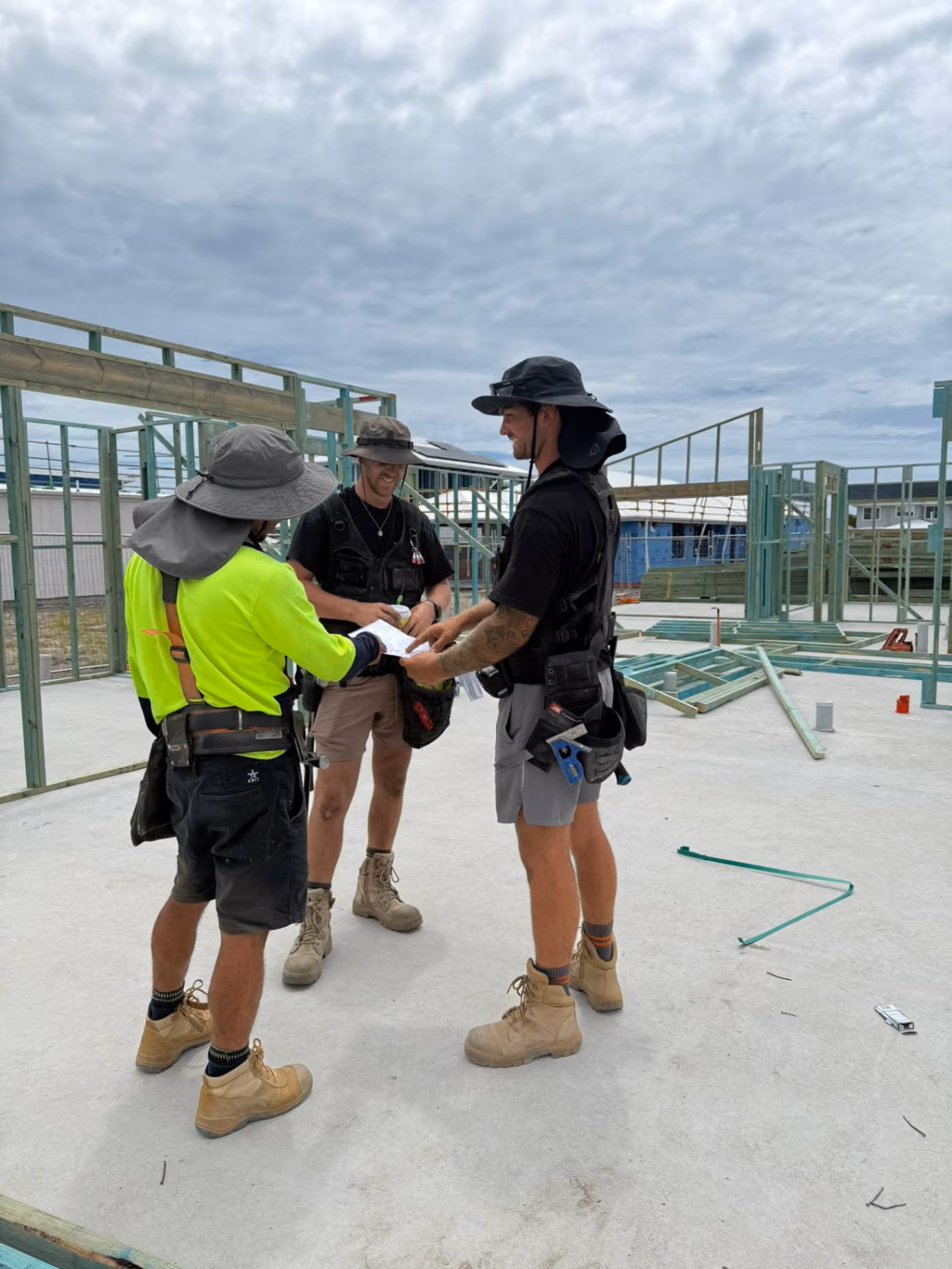 Carpenter checking framing on site