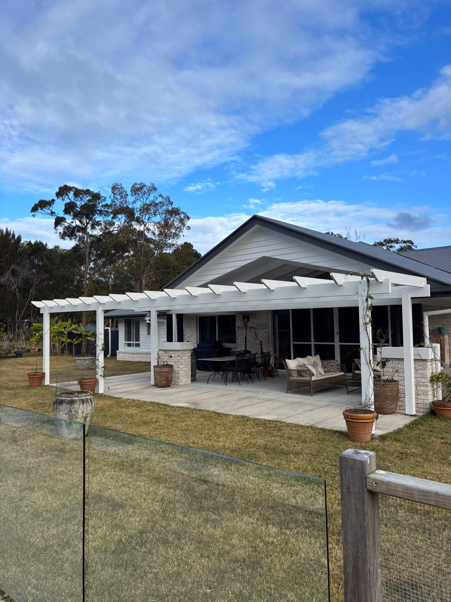 Timber decking running alongside a pool