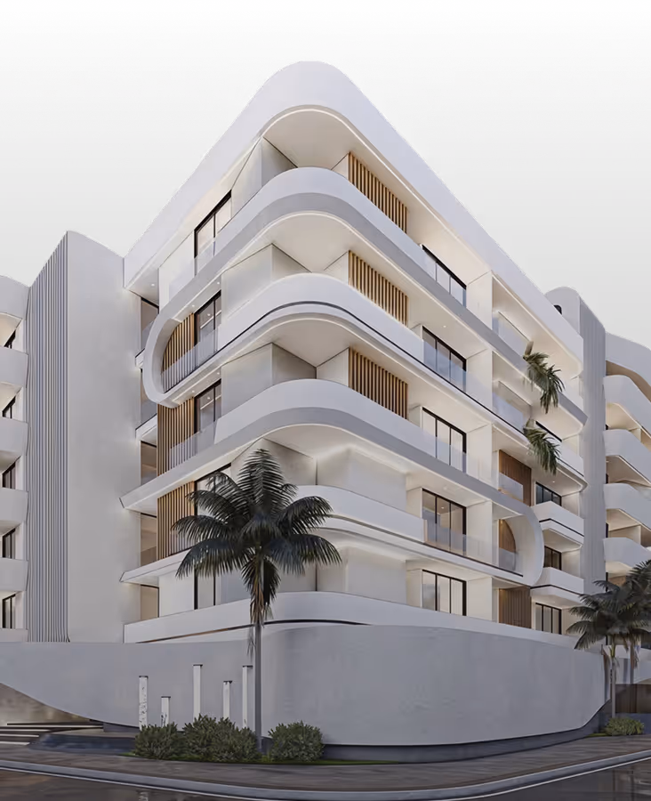 Modern white multi-story building with curved balconies, palm trees, and large windows at night.