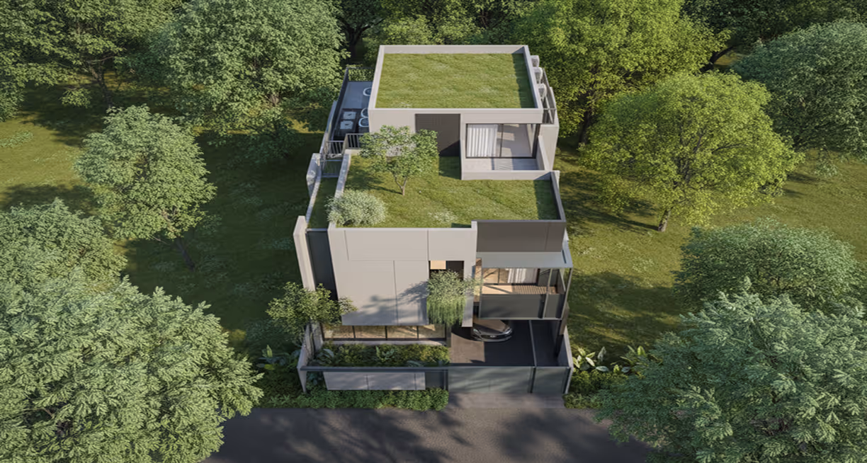 Modern two-story house with green rooftop terraces surrounded by lush trees and vegetation.