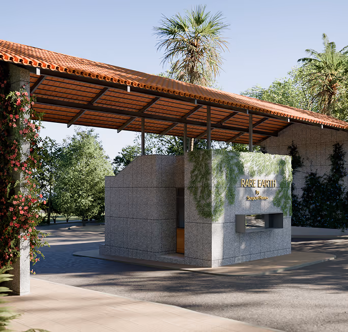 Modern entrance gate to Rare Earth Sunqua Homes with stone walls, greenery, and a tiled roof.