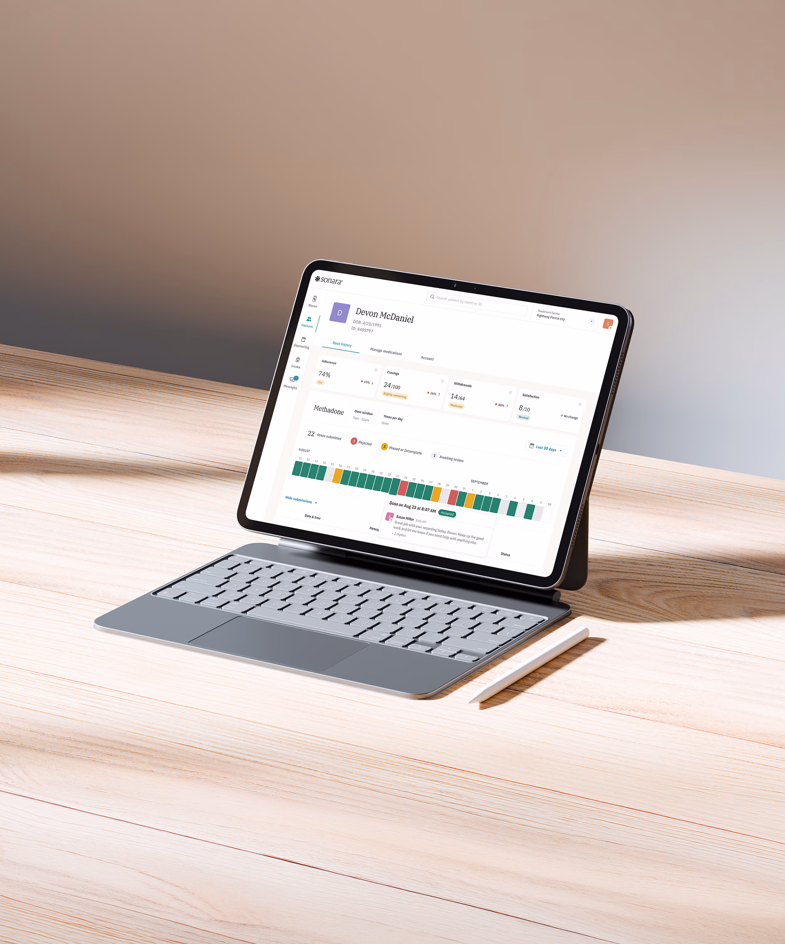 Tablet with keyboard and stylus on a light wooden surface displaying a Sonara patient profile dashboard.