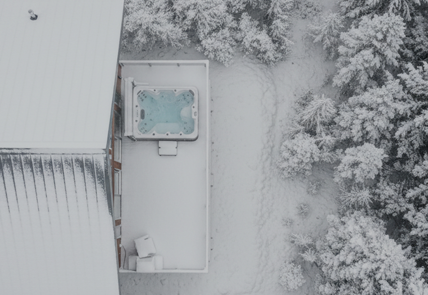 Custom home in winter built by Facet Custom Builders