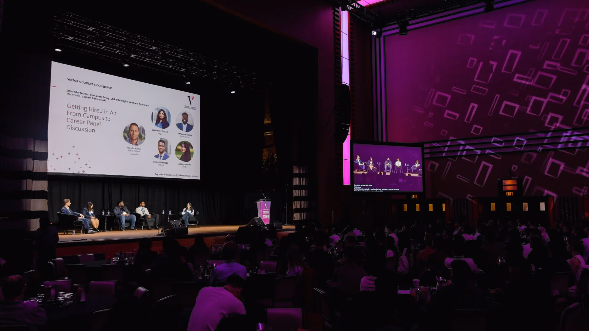 Five panelists seated in armchairs on stage for the "Getting Hired in AI: From Campus to Career Panel Discussion" at the Vector Institute AI Summit and Career Fair. The projected slide identifies the participants: moderator Adam Renkosinski of Vector Institute and panelists Jaswinder Narain (PwC), Immanuel Tacky (Canadian Tire), Chike Odenigbo (TD Bank) and Sana Ayromlou (Google). Vector Institute banners flank the stage on both sides.