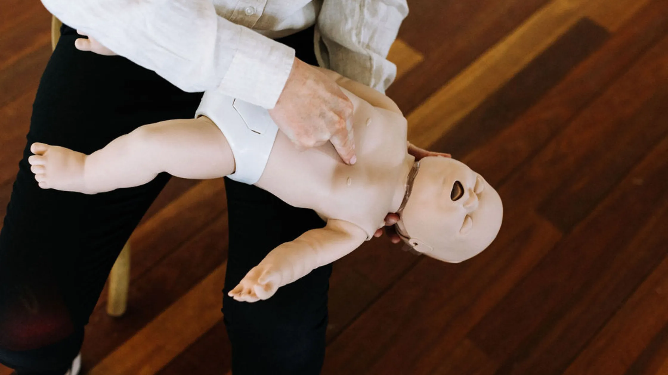 A paediatric nurse teaching first aid with children