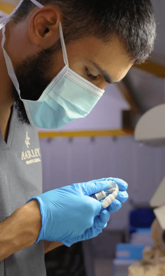 Harley Private clinician examining a dental restoration
