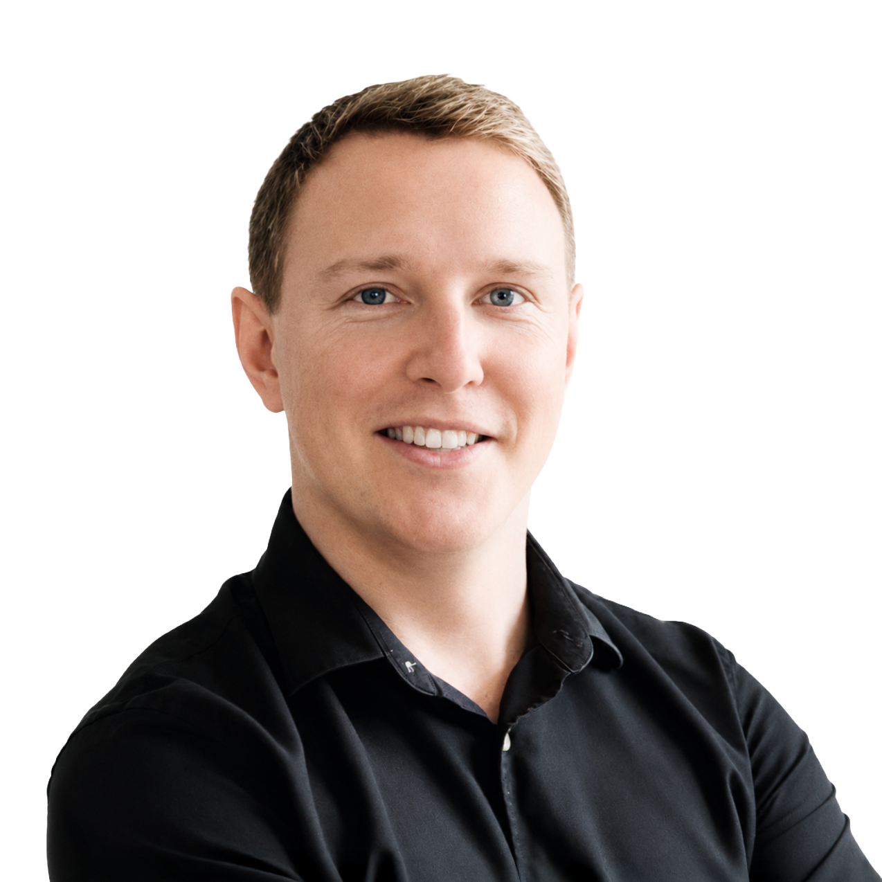 Smiling man with short blond hair wearing a black shirt against a white background.