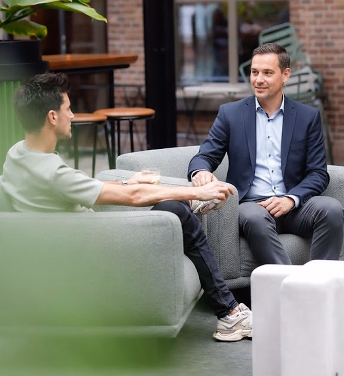 Two professionals discussing payment strategy during a consultation
