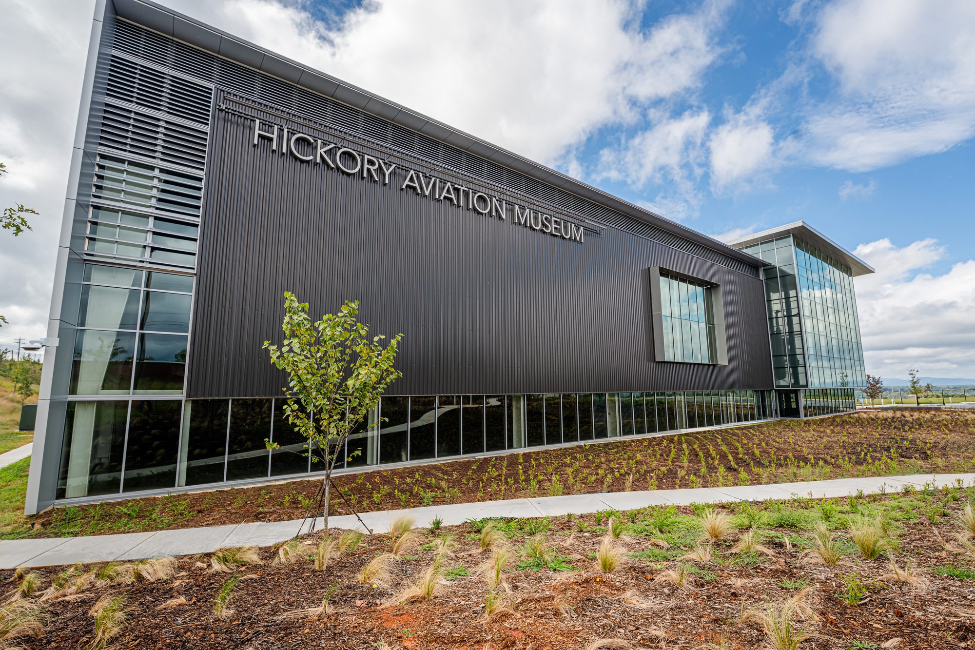 Hickory Aviation Museum entrance with stick curtainwall and signage