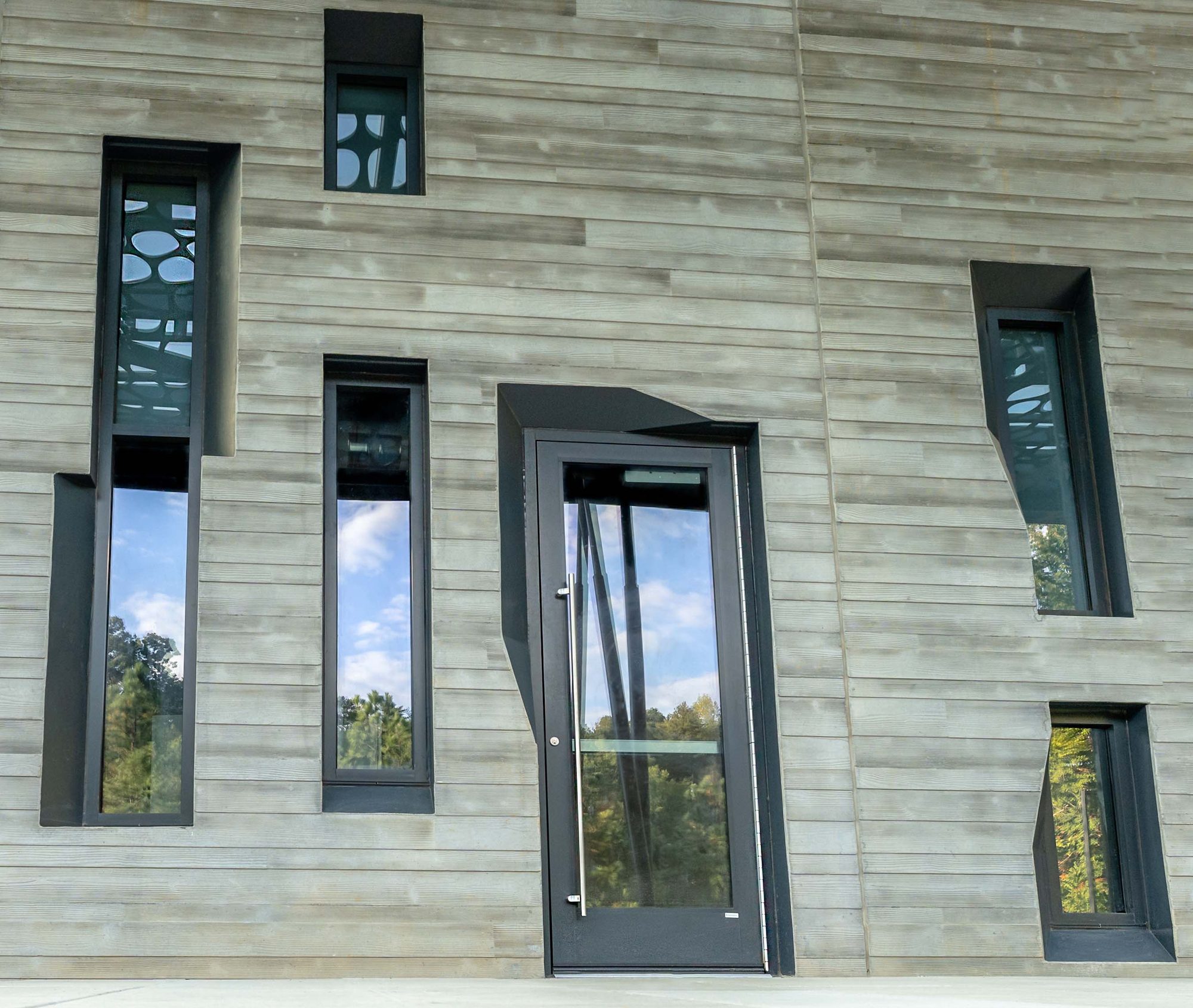 Angled punched windows at the early childhood education center