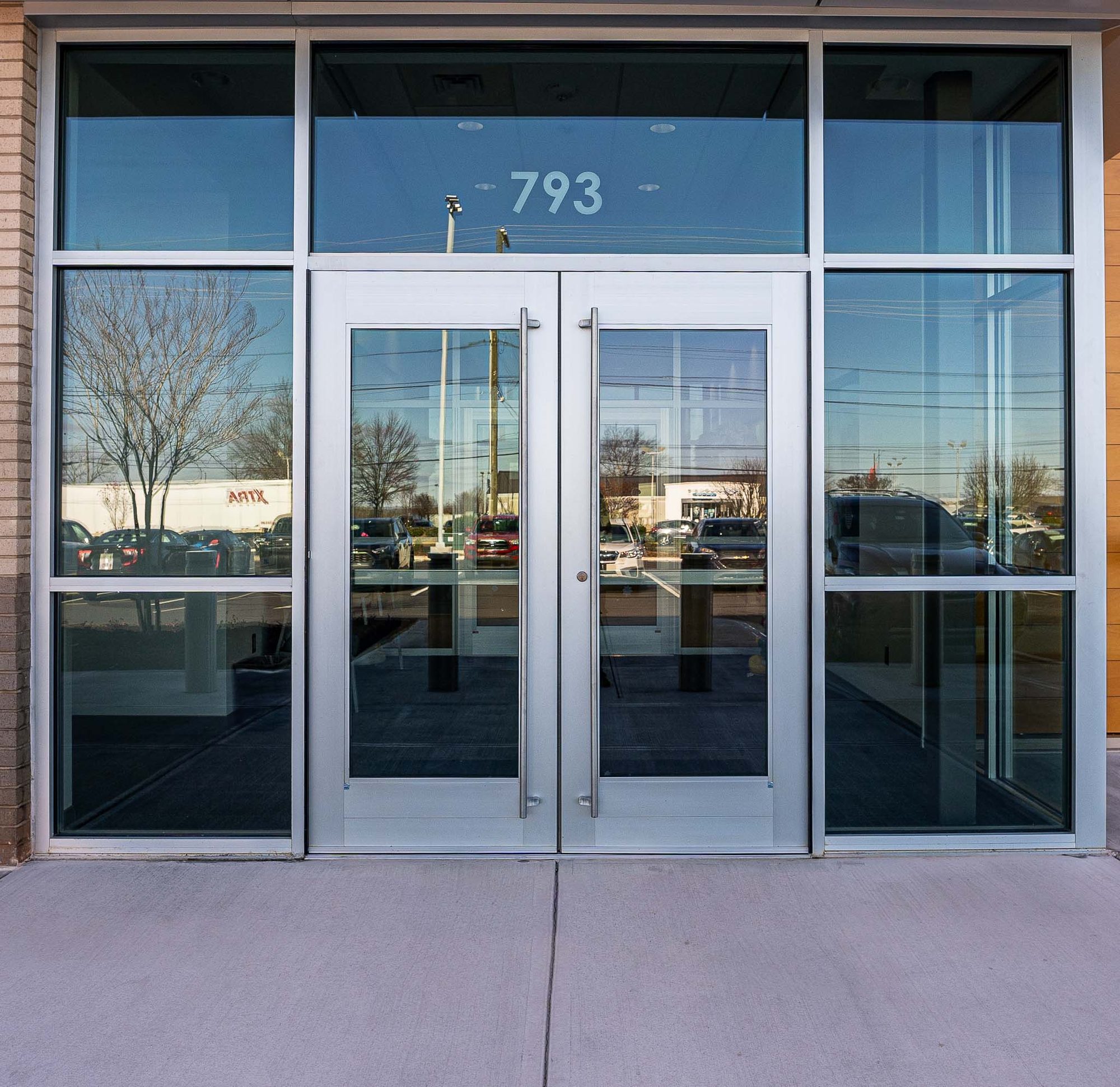 Main entrance with bullet-resistant aluminum framing at Cabarrus County EMS