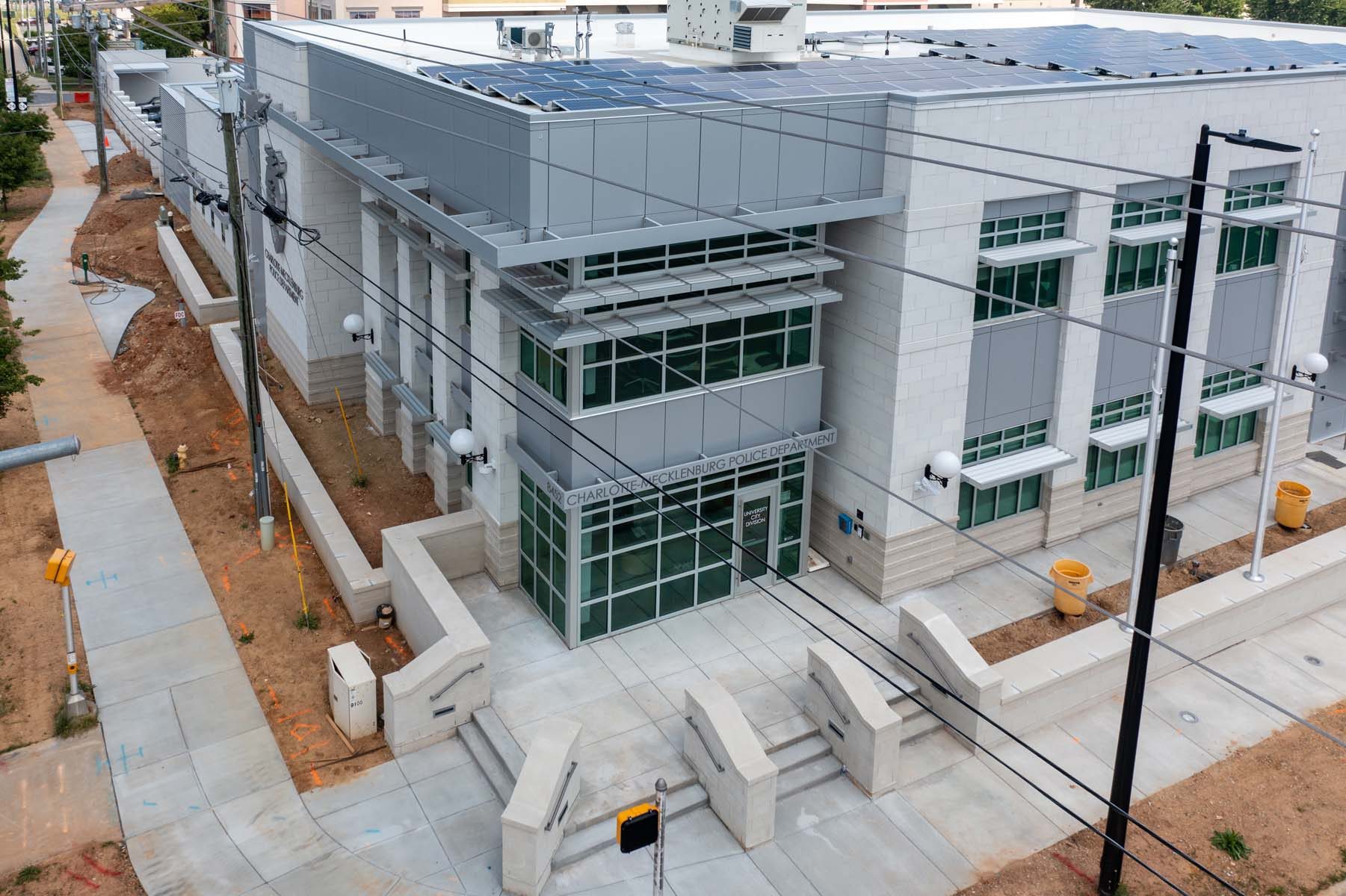 Aerial view of the glass entry tower at the CMPD station