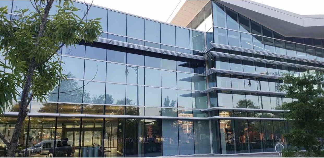 Curved curtainwall facade with horizontal sunshades at The FAST Center