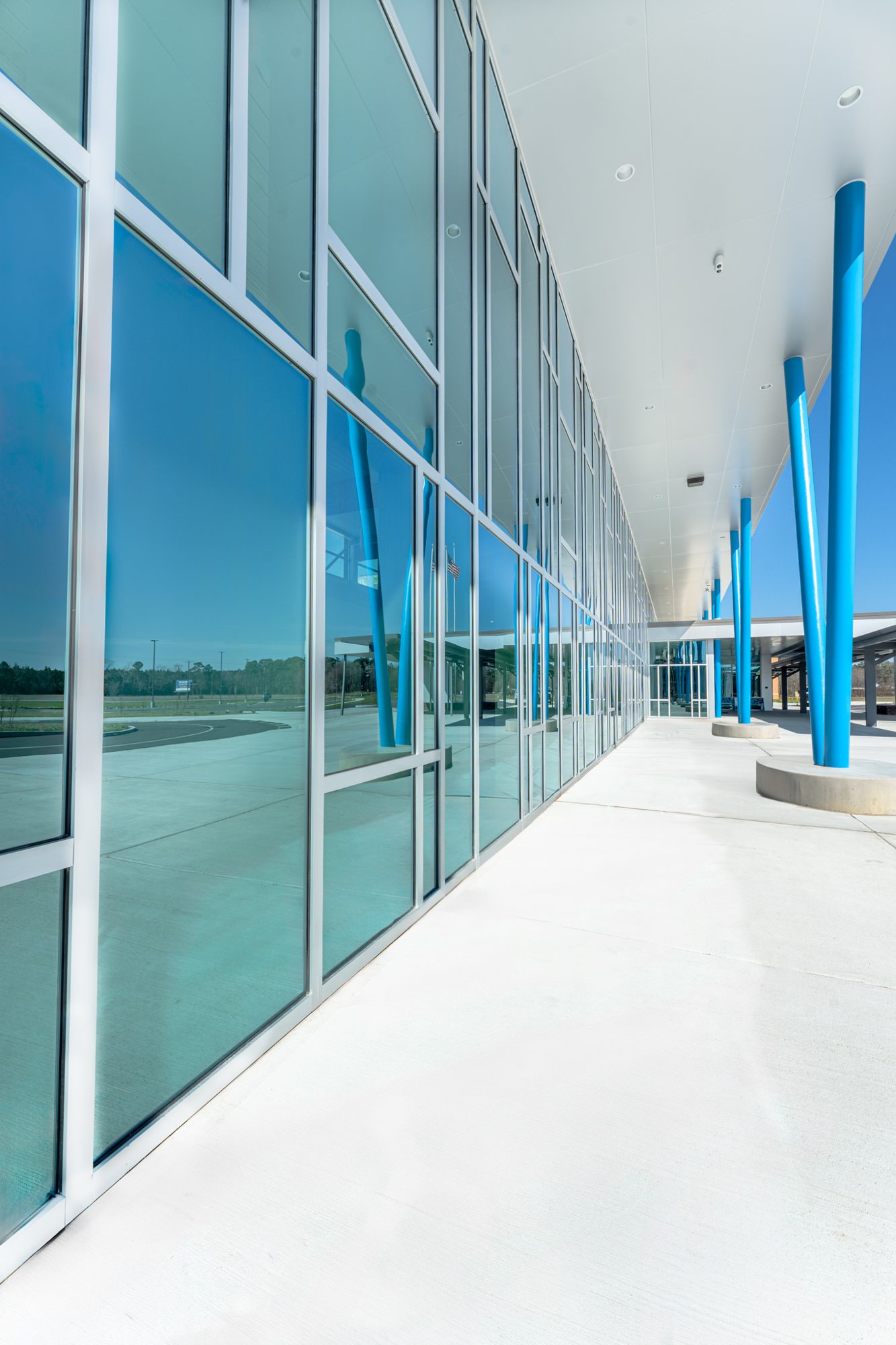 Covered walkway along a long run of curtain wall