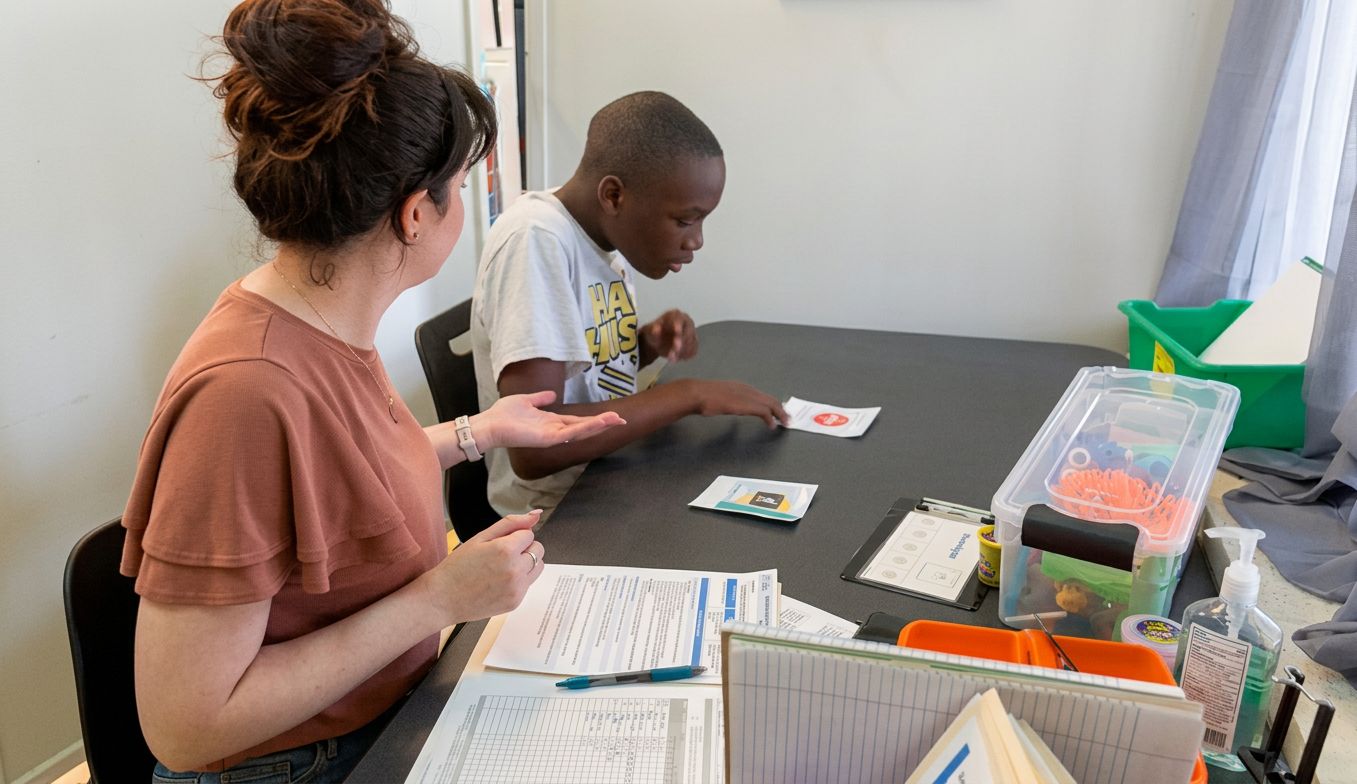 Student working with a teacher.