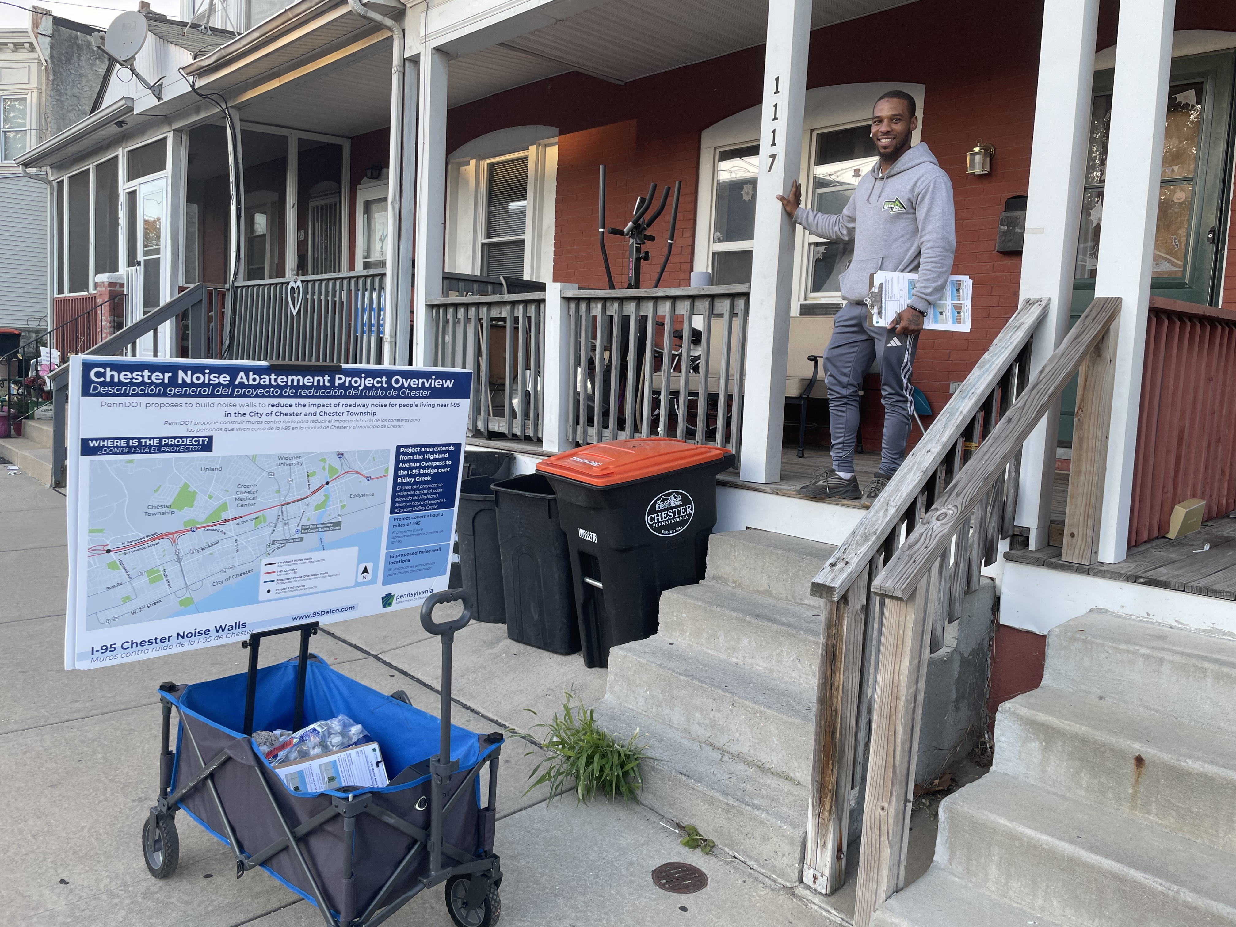 A field team member is door knocking in a residential street