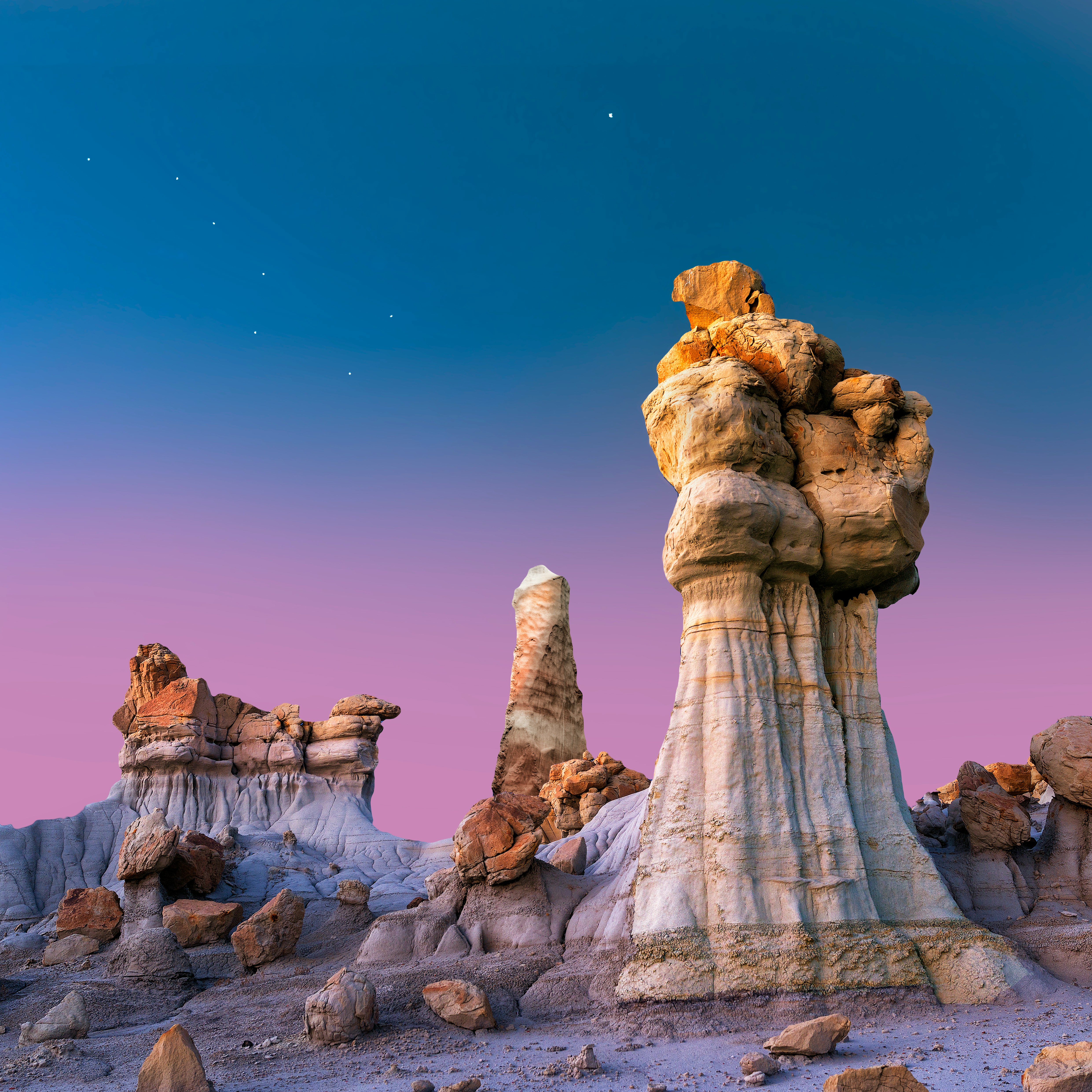 This striking image of the New Mexico landscape features the rock formations against a colorful sky.
