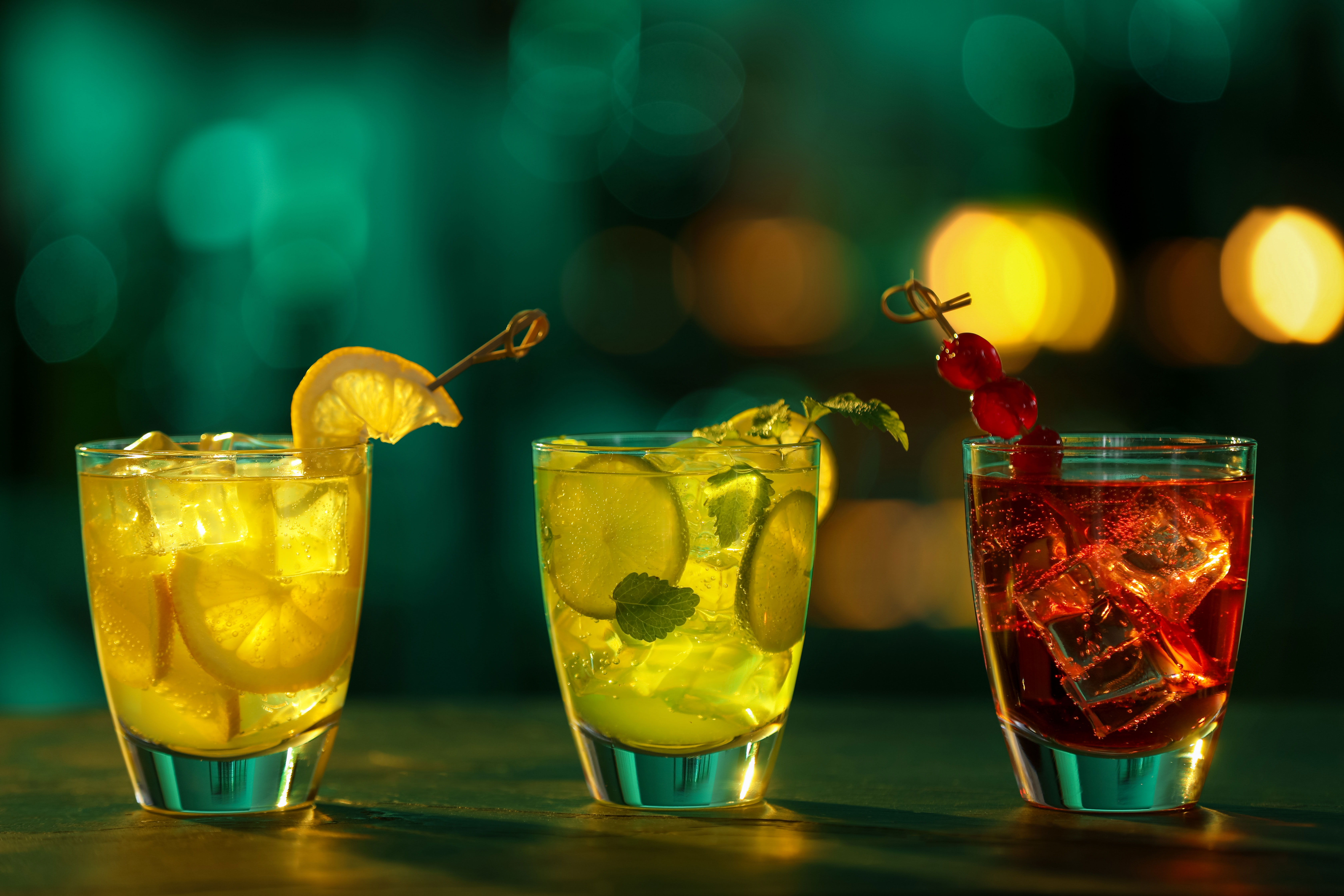 Several cocktails in glasses on a table