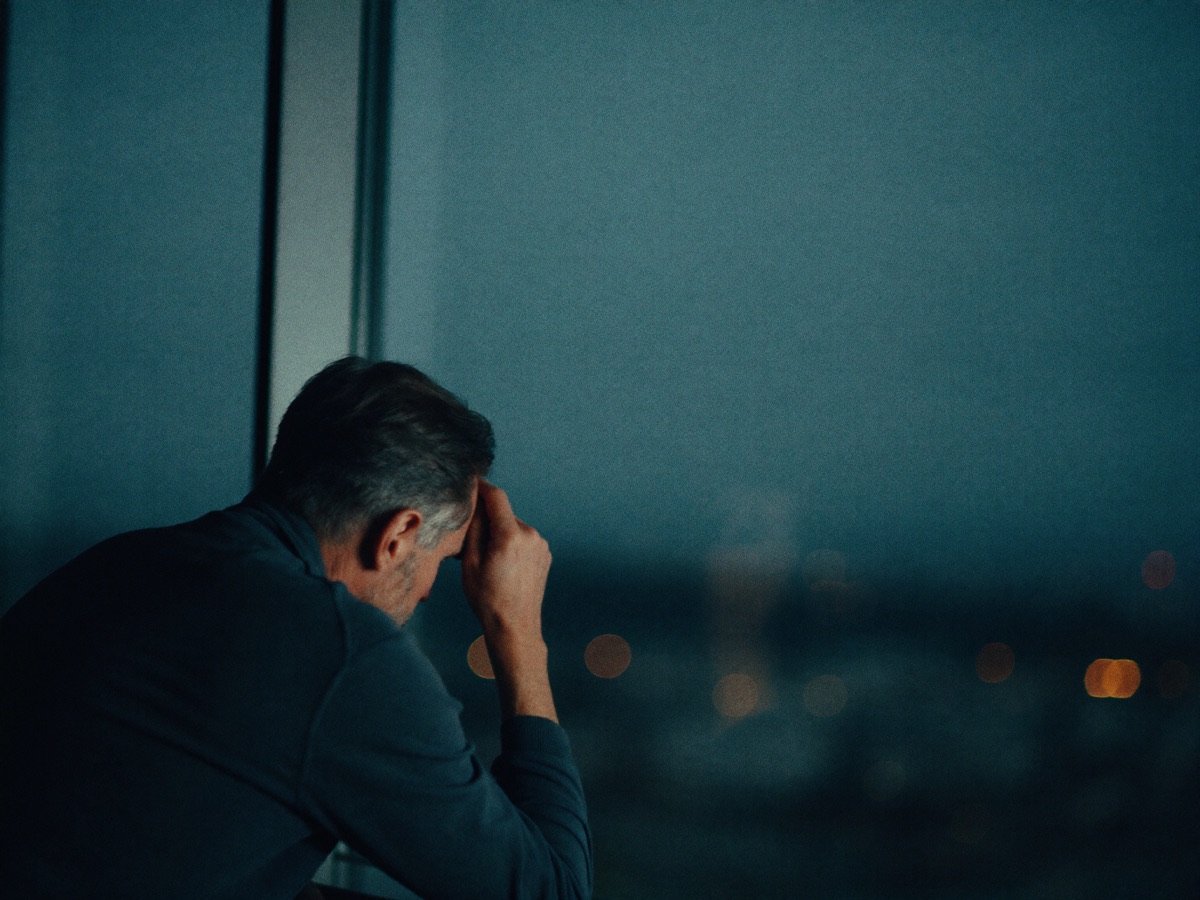 A man at a desk lost in thought