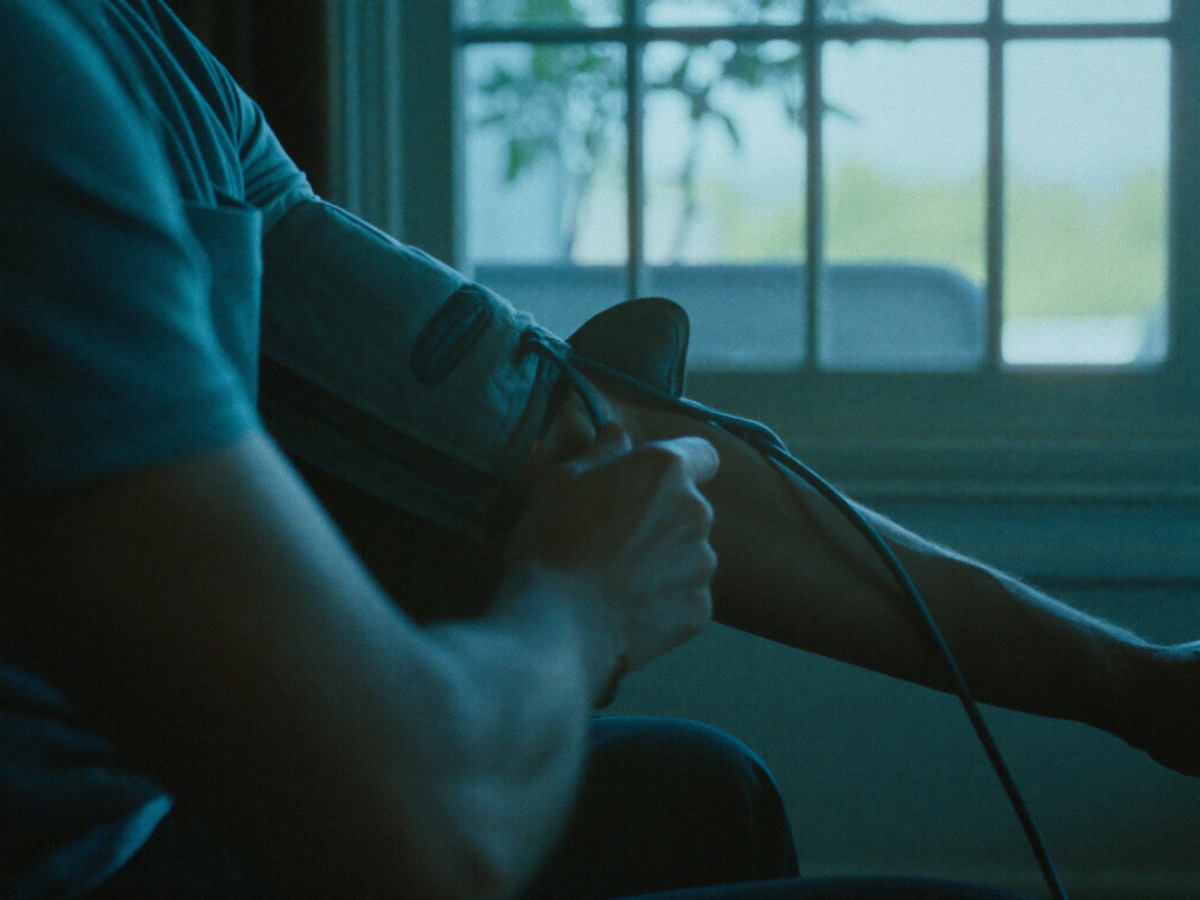 A home blood pressure cuff on an arm