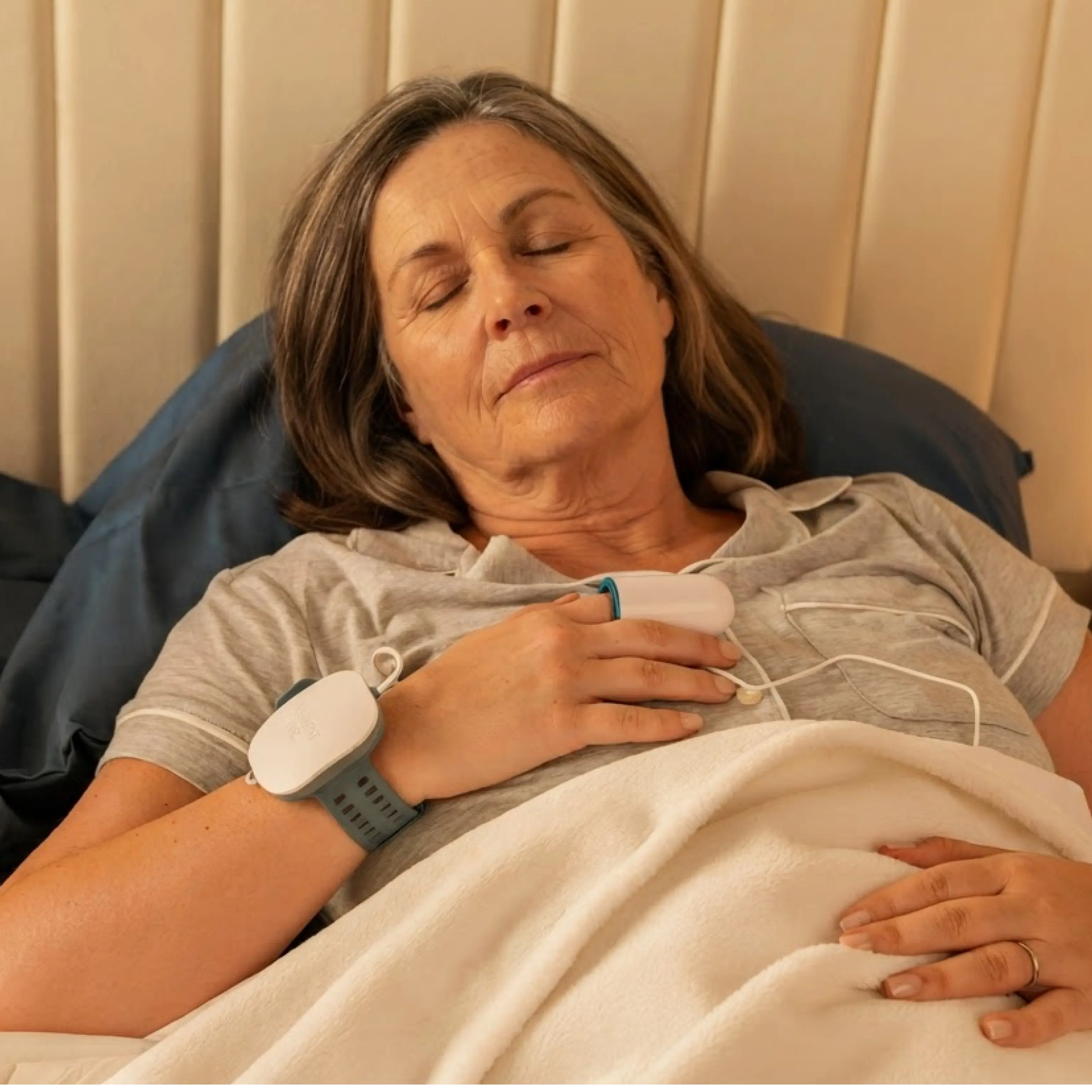 A woman sleeping using a WatchPAT Home Sleep Test