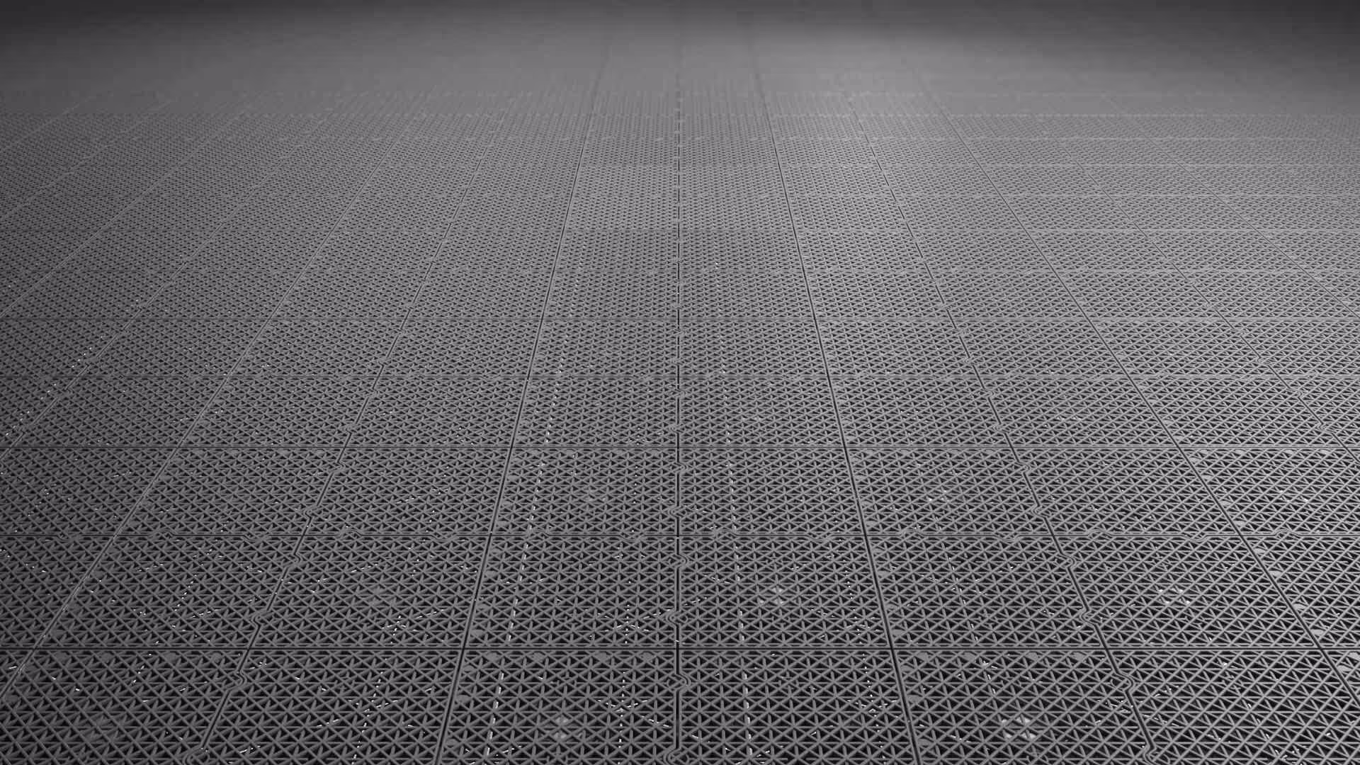 A black and white photo of a tile floor.