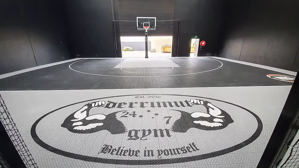 A basketball court with a basketball hoop in the middle of it.