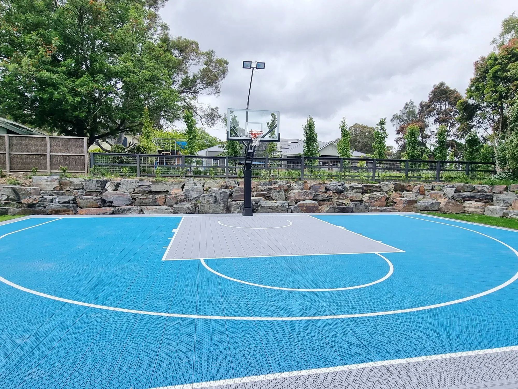 A basketball court with a basketball hoop in the middle of it.