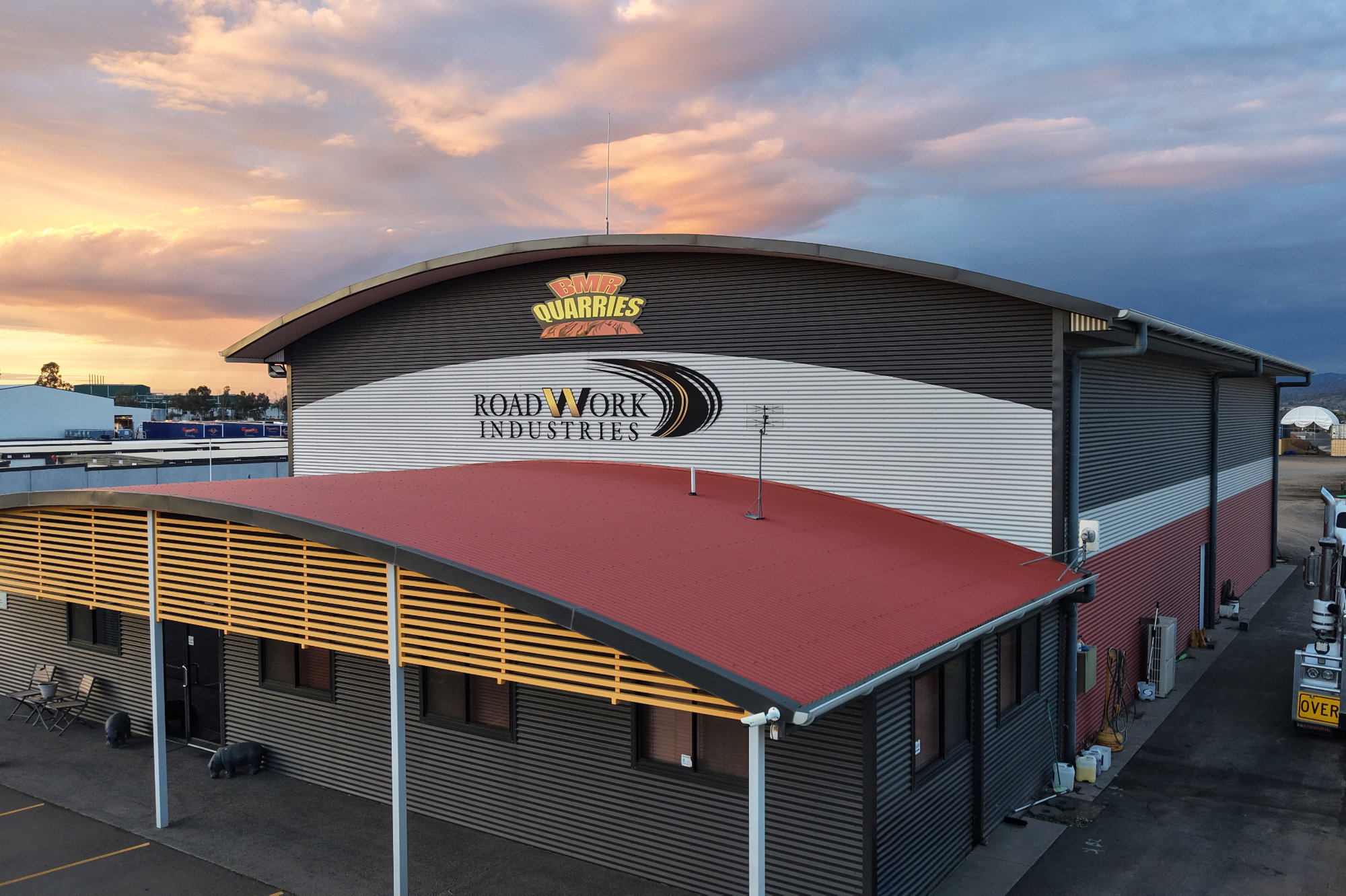 Road Work Industries office front with red curved awning at the BMR Quarries site