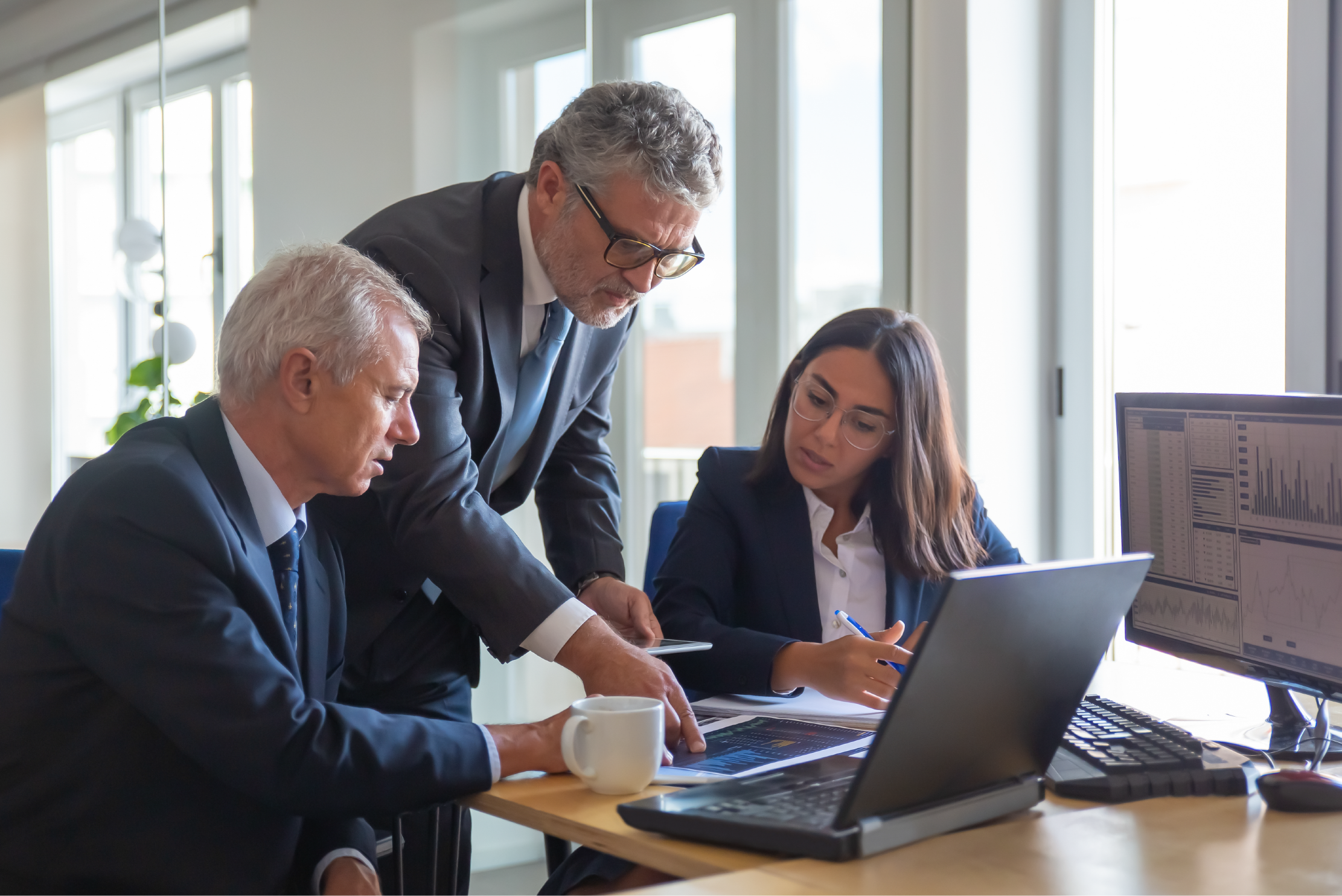 Attorneys look at a computer together