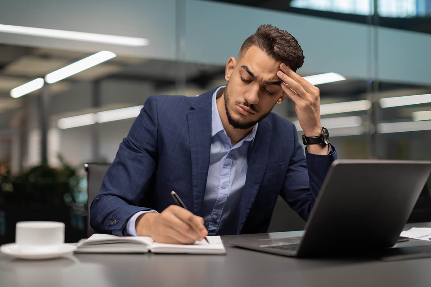 Lawyer manually drafting documents on paper