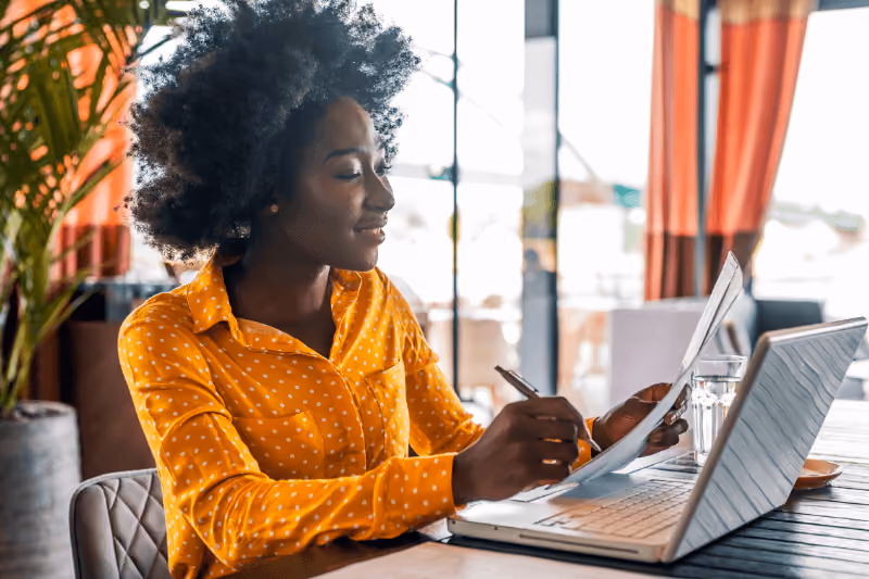 Woman sitting at desk using the computer