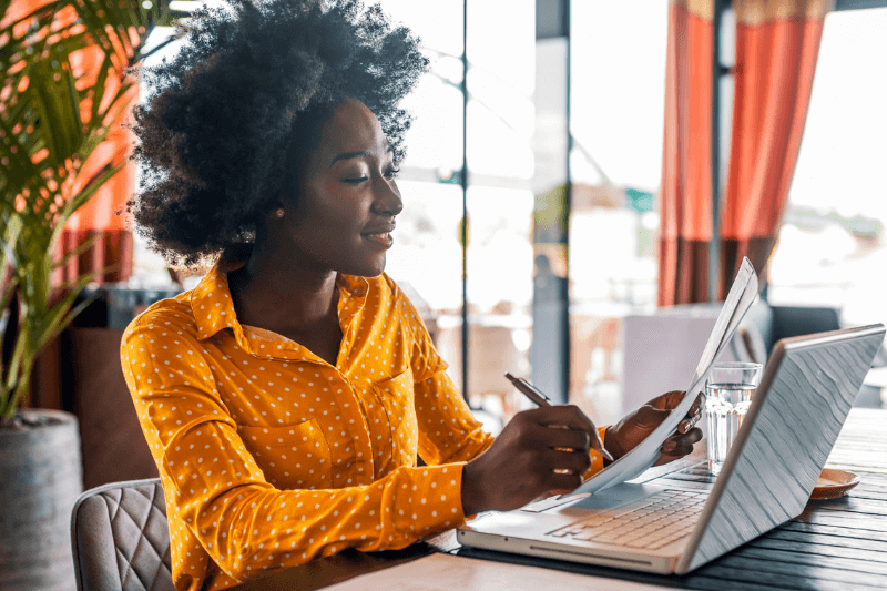 Woman sitting at desk using the computer