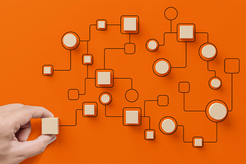 orange background with wooden blocks representing workflows