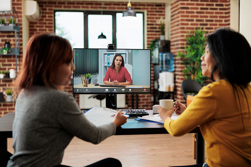 Two women interviewing a candidate for job role