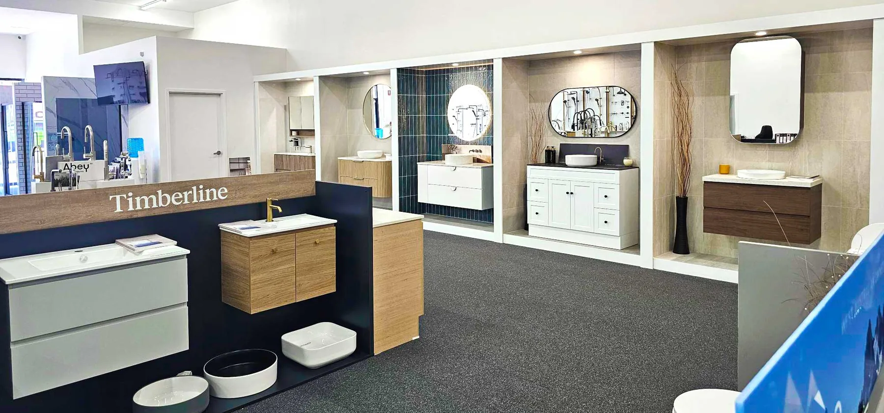 Wide view inside the Osborne Park showroom with Timberline signage and vanity display bays
